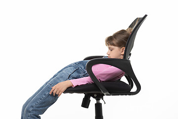Image showing Girl funny lay down in an office chair