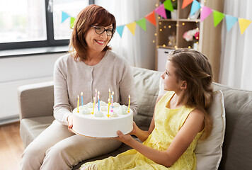 Image showing grandmother and granddaughter with birthday cake