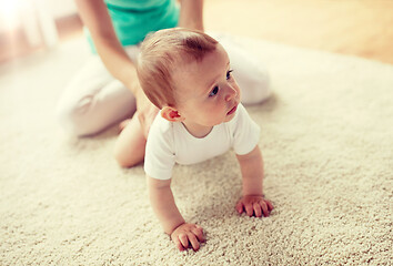 Image showing mother with baby on floor at home