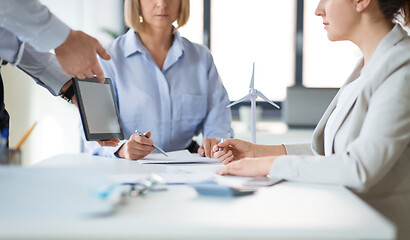 Image showing close up of business team with tablet pc at office