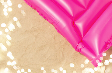 Image showing pink swimming mattress on beach