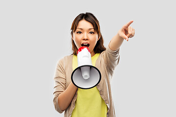 Image showing asian woman speaking to megaphone