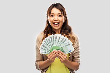 Image showing asian woman with hundred euro money banknotes