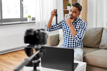 Image showing male video blogger with smart watch videoblogging