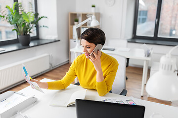 Image showing ui designer calling on smartphone at office