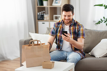 Image showing man using smartphone for food delivery