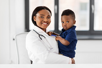 Image showing doctor or pediatrician with baby patient at clinic