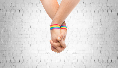 Image showing hands of couple with gay pride rainbow wristbands