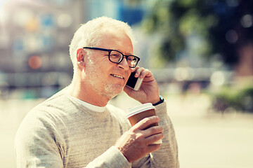 Image showing happy senior man calling on smartphone in city