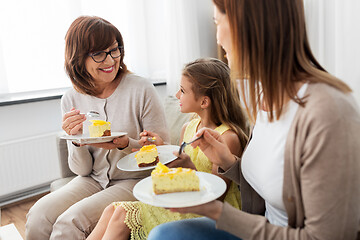 Image showing mother, daughter and grandmother eating cake