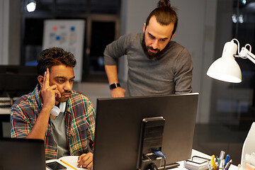 Image showing creative team with computer working late at office