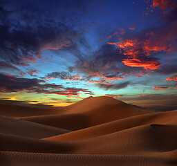 Image showing sand dunes in desert at sunset