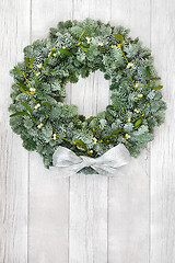 Image showing Snow Covered Fir and Mistletoe Wreath