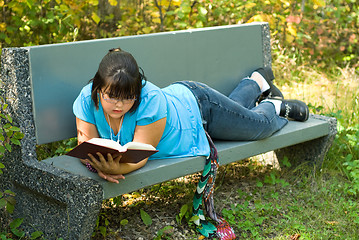 Image showing Girl Reading Outside