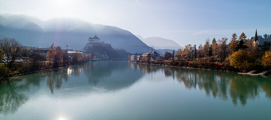 Image showing Panoramic view on smooth surface of river before Kufstein Fortress, Austria.