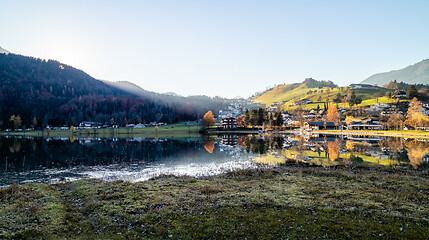 Image showing Panoramic landscape with traditional houses on the bank of lake, Austria.