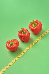 Image showing Healthy set from fresh ripe red paprika pepper measuring tape.