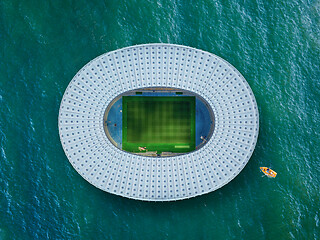 Image showing Building of football stadium on a blue sea background.