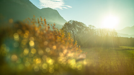 Image showing Creative landscape with blurred forefront on a sunny sky background, Austria.