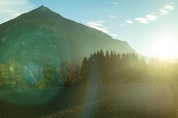 Image showing Mountain landscape with forest area on a background of sun light, Austria.