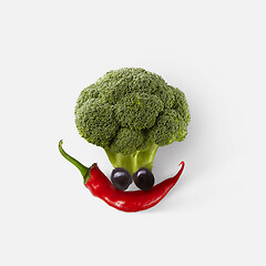 Image showing Natural fresh vegetable composition in the shape of funny face.