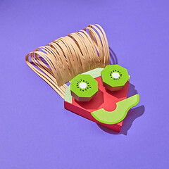 Image showing Papercraft composition from fruits peaces in the shape of face.