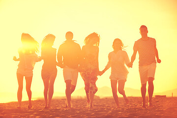 Image showing happy young  people group have fun on beach