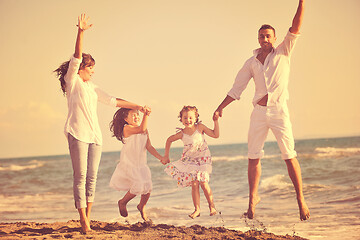 Image showing happy young  family have fun on beach