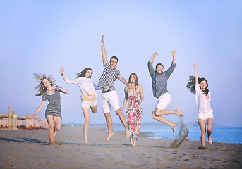 Image showing happy young  people group have fun on beach