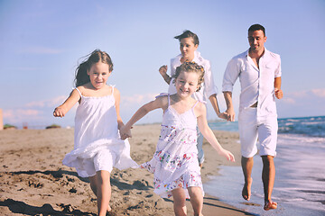 Image showing happy young  family have fun on beach