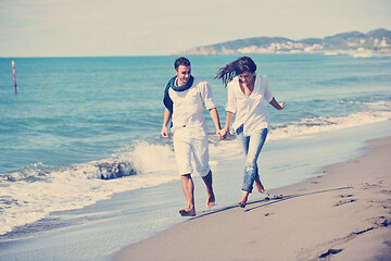 Image showing happy young couple have fun at beautiful beach