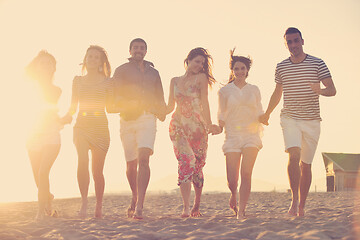 Image showing happy young  people group have fun on beach