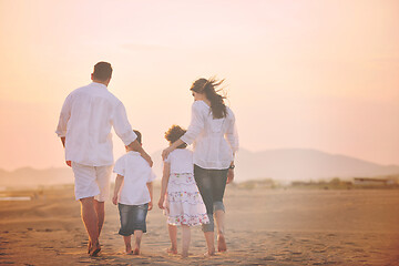 Image showing happy young family have fun on beach at sunset