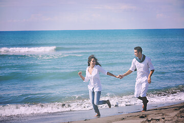 Image showing happy young couple have fun at beautiful beach