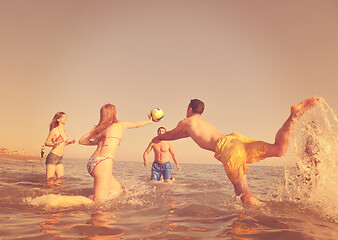 Image showing young people group have fun and play beach volleyball