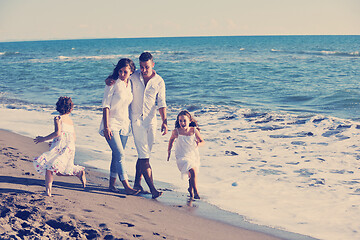 Image showing happy young  family have fun on beach