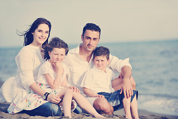 Image showing happy young family have fun on beach