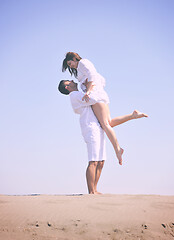 Image showing happy young couple have fun on beach