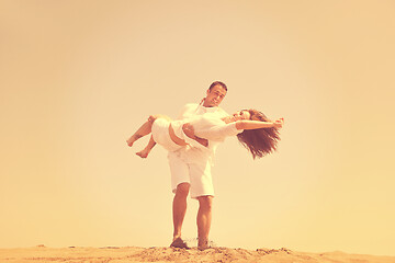 Image showing happy young couple have fun on beach