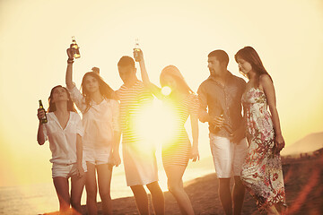 Image showing Group of young people enjoy summer  party at the beach