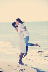 Image showing happy young couple have fun at beautiful beach