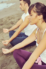 Image showing couple yoga beach