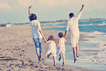 Image showing happy young  family have fun on beach