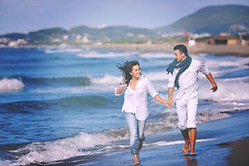 Image showing happy young couple have fun at beautiful beach