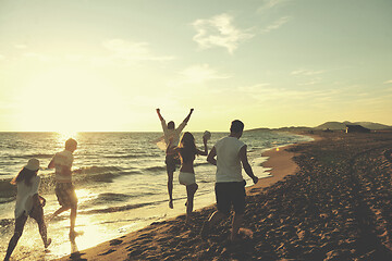 Image showing people group running on the beach