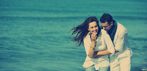 Image showing happy young couple have fun at beautiful beach