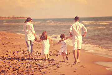 Image showing happy young  family have fun on beach