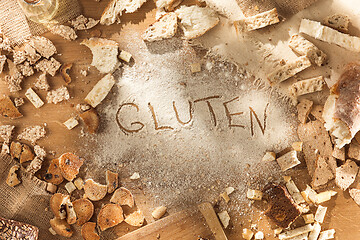 Image showing Gluten free food. Various pasta, bread and snacks on wooden background from top view