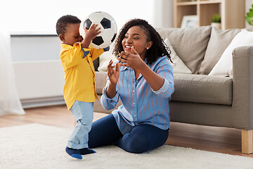 Image showing mother and baby playing with soccer ball at home