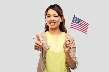 Image showing happy asian woman with american flag